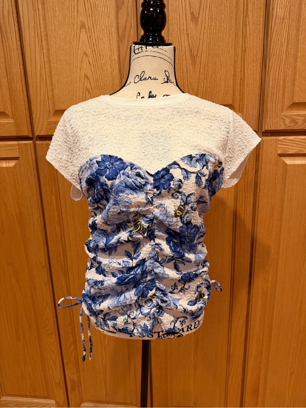 Maeve / Anthropologie White Top with Blue Floral Ruched Front and Sides
